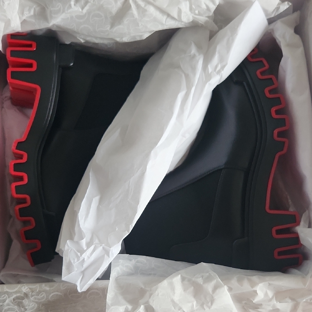 Christian Louboutin Marcharoche Dune boots.